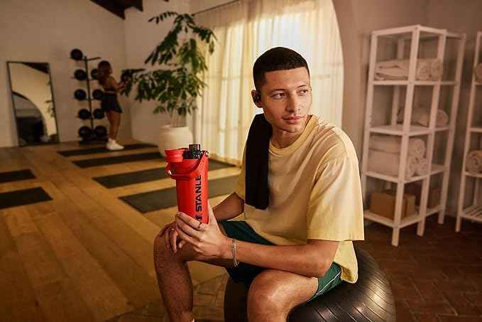STANLEY Vitalize Shaker Bottle 20 oz | Leakproof Insulated Stainless Steel Shaker Cup | Base Storage and Twist On Fast Flow Lid | Protein Shakes and Pre Workout Powder | BPA-Free | Chili Red